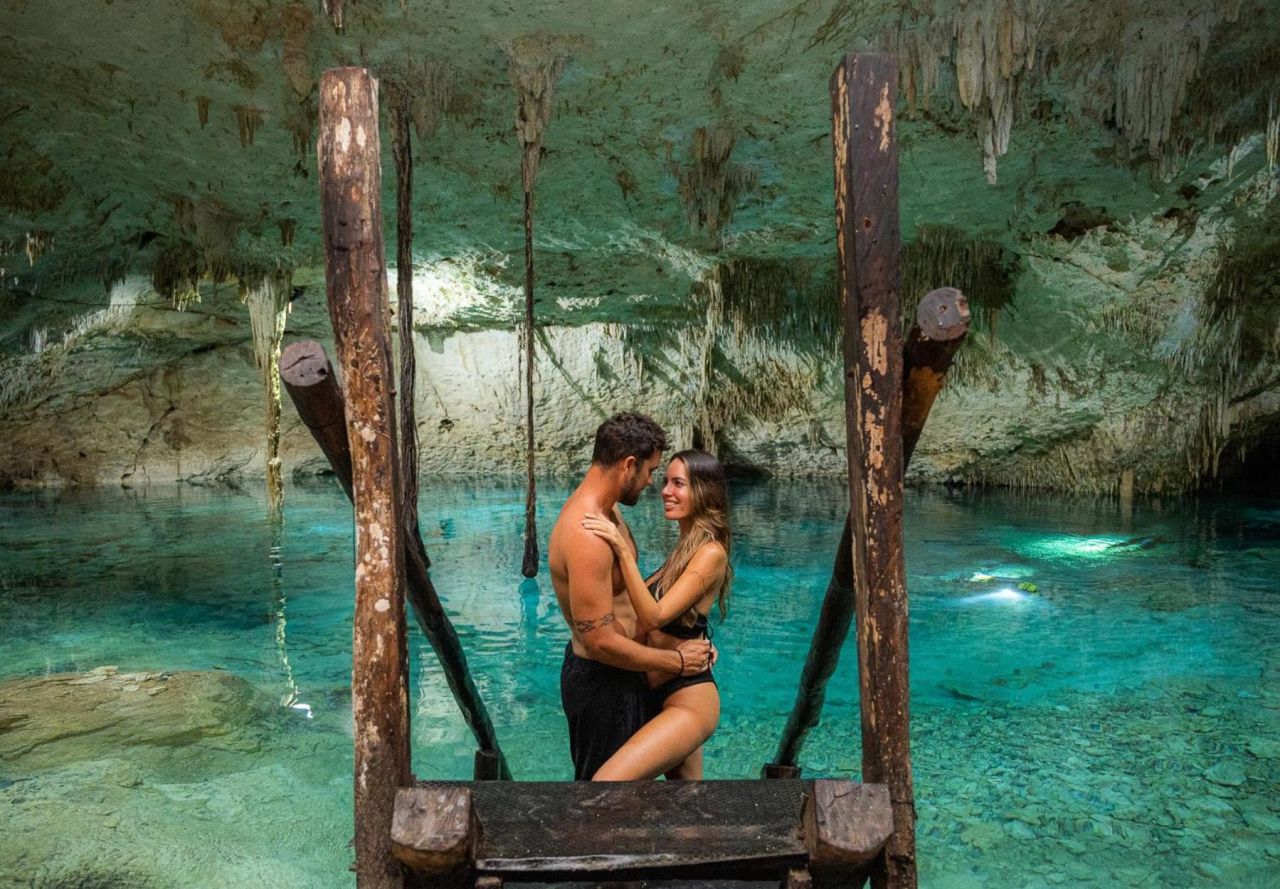 Couple in Cenote by Yellow Nest Hotel